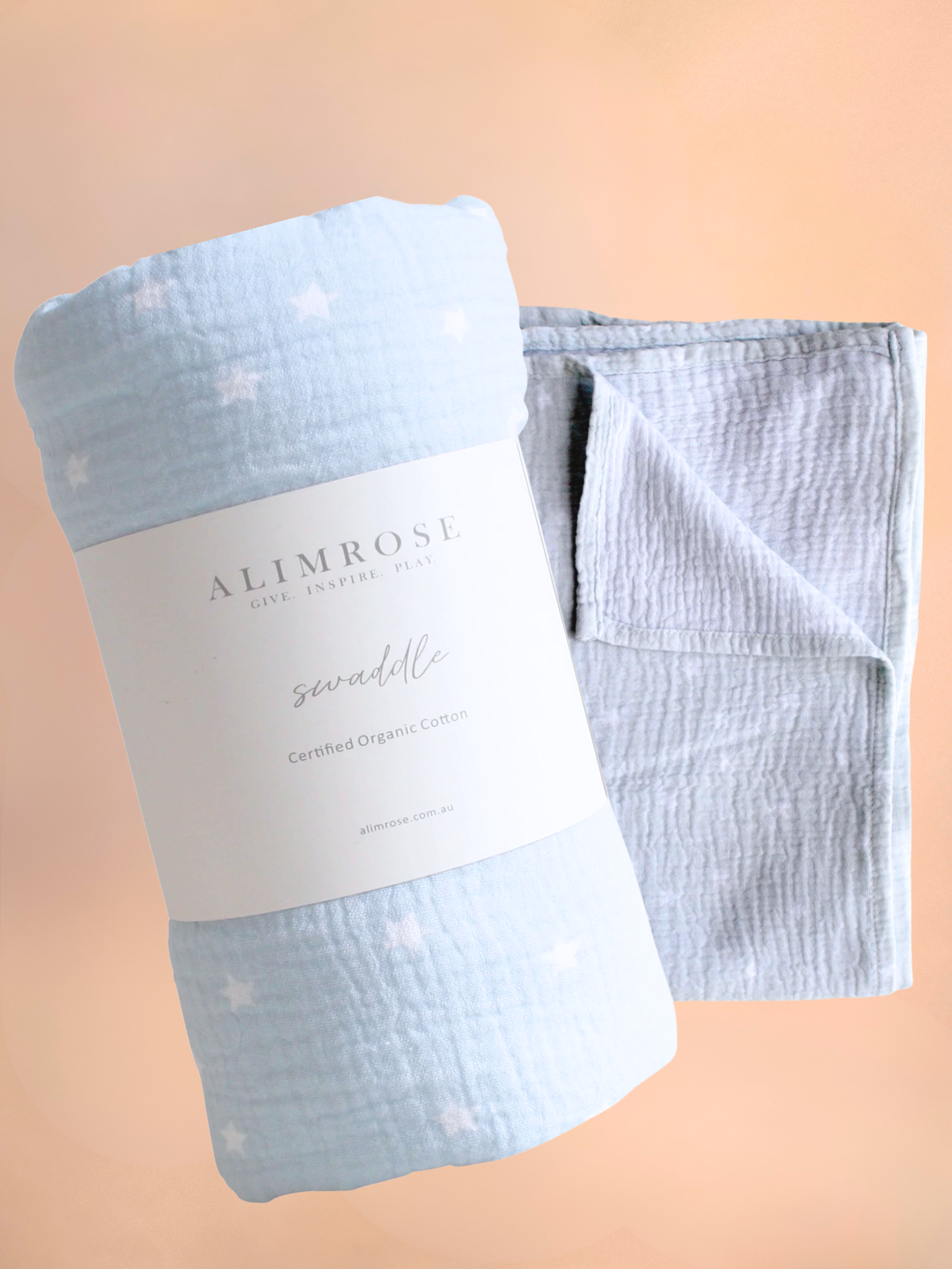Light blue swaddle blanket with white polka dots and 'Alimrose' label on a beige background, Flowers Gold Coast